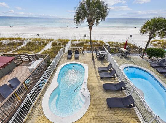 Just Beachy - 5 Bedroom Beach Front Home! Sleeps 20 Home by RedAwning is a family friendly hotel in Upper Grand Lagoon, Florida (FL)